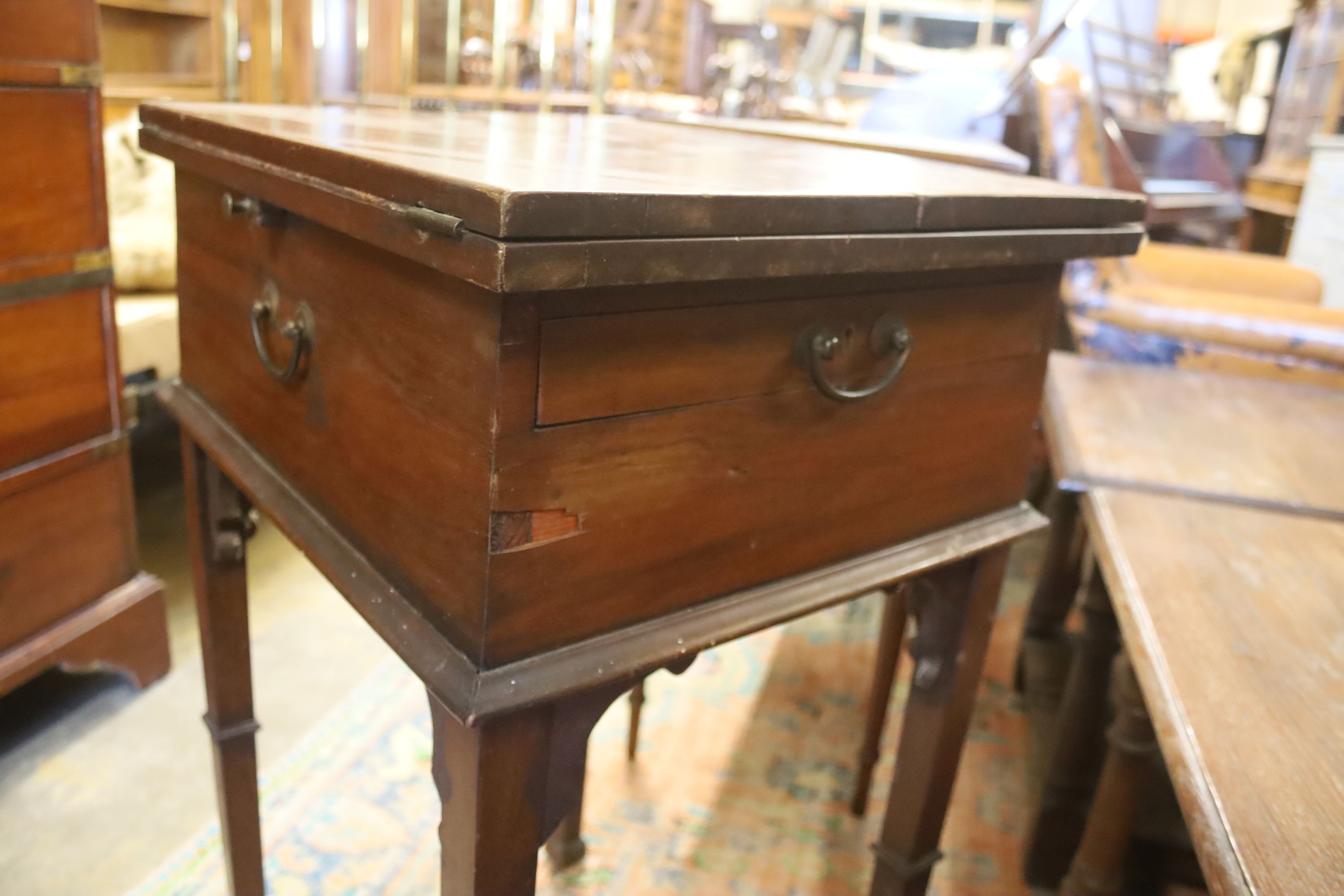 A Victorian mahogany writing/work table with twin hinged flap top, width 42cm, depth 50cm, height 77cm